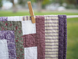 Floral Patchwork Quilt with Purple Back