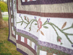 Floral Patchwork Quilt with Purple Back