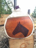 Our Rodeo Gear Bag measures 24"x12". This bag is built from our heavy 15 ounce canvas, has a #10  brass zipper, handles with a leather grip, leather shoulder strap and two leather end pockets that can be customized.