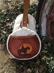 Our Rodeo Gear Bag measures 24"x12". This bag is built from our heavy 15 ounce canvas, has a #10  brass zipper, handles with a leather grip, leather shoulder strap and two leather end pockets that can be customized.