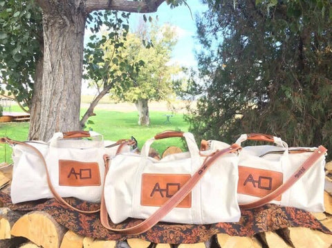 Our Rodeo Garrett bags are constructed from our heavy 15 ounce canvas, two end pockets, a stout brass zipper, leather gripper, with snaps, on the handles. A leather shoulder strap, which can be personalized.