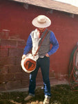 Our Rodeo Gear Bag measures 24"x12". This bag is built from our heavy 15 ounce canvas, has a #10  brass zipper, handles with a leather grip, leather shoulder strap and two leather end pockets that can be customized.