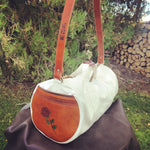Our Rodeo Gear Bag measures 24"x12". This bag is built from our heavy 15 ounce canvas, has a #10  brass zipper, handles with a leather grip, leather shoulder strap and two leather end pockets that can be customized.