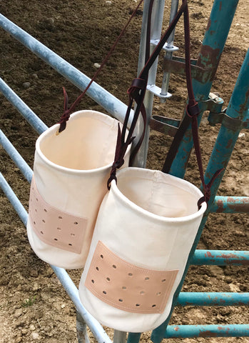 Our Morale Feed Bags are built with our heavy duty, 15 oz canvas. They have a double reinforced bottom, a leather and screen vent to allow air to flow into the bag, and an adjustable leather strap.